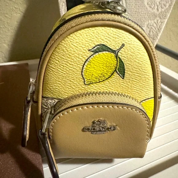 NWT Coach Mini backpack keychain Cream and Yellow Lemon Print SOLD OUT - Picture 2 of 3